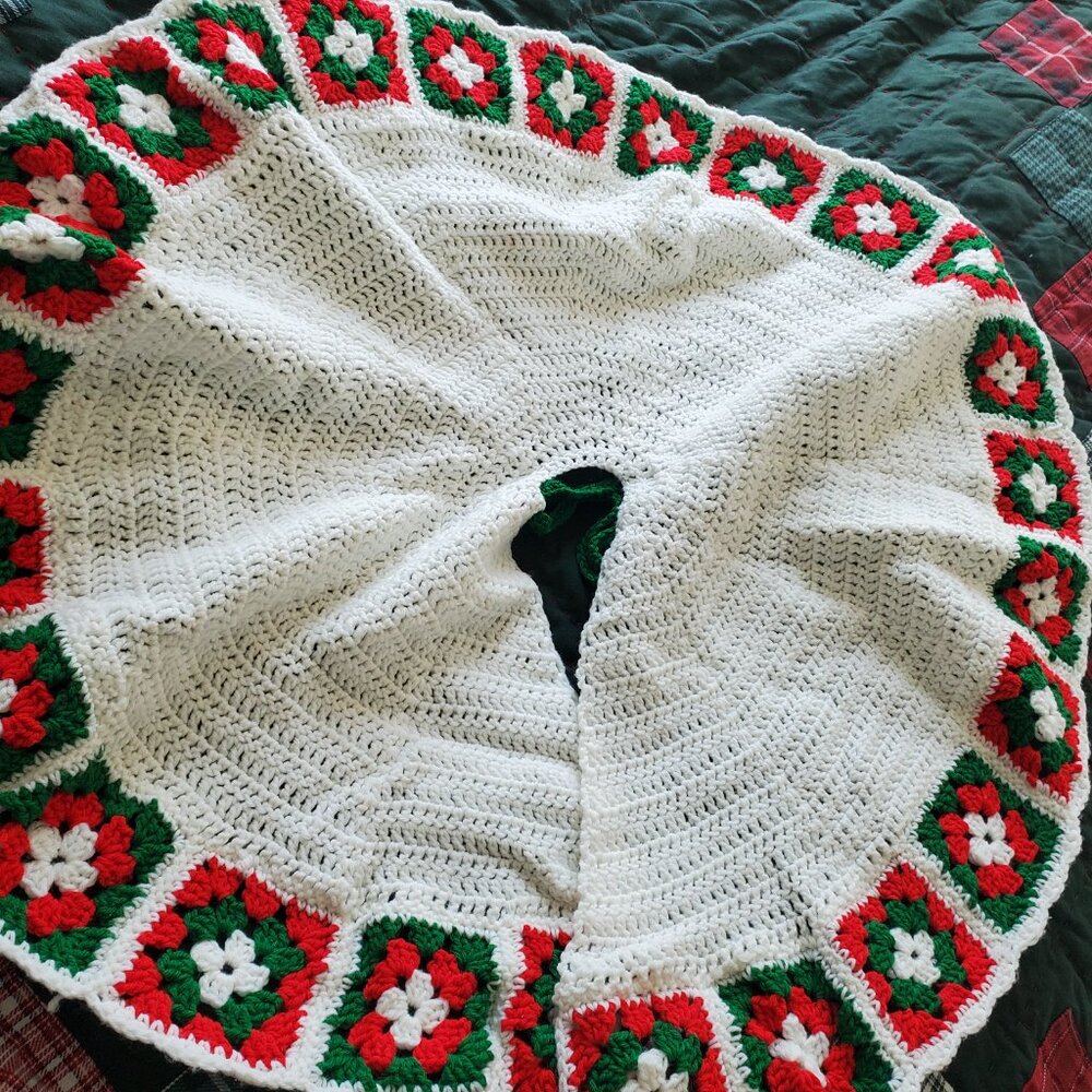 Vintage Granny’s crocheted Christmas tree skirt with poinsettia pattern 36” D